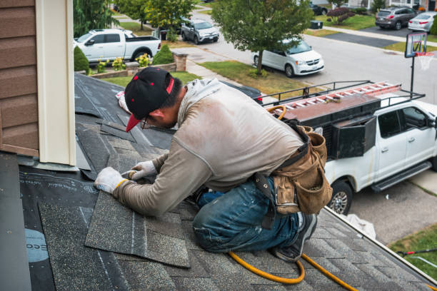 Professional Storm Damage Roof Repair technician working in Aurora, IN